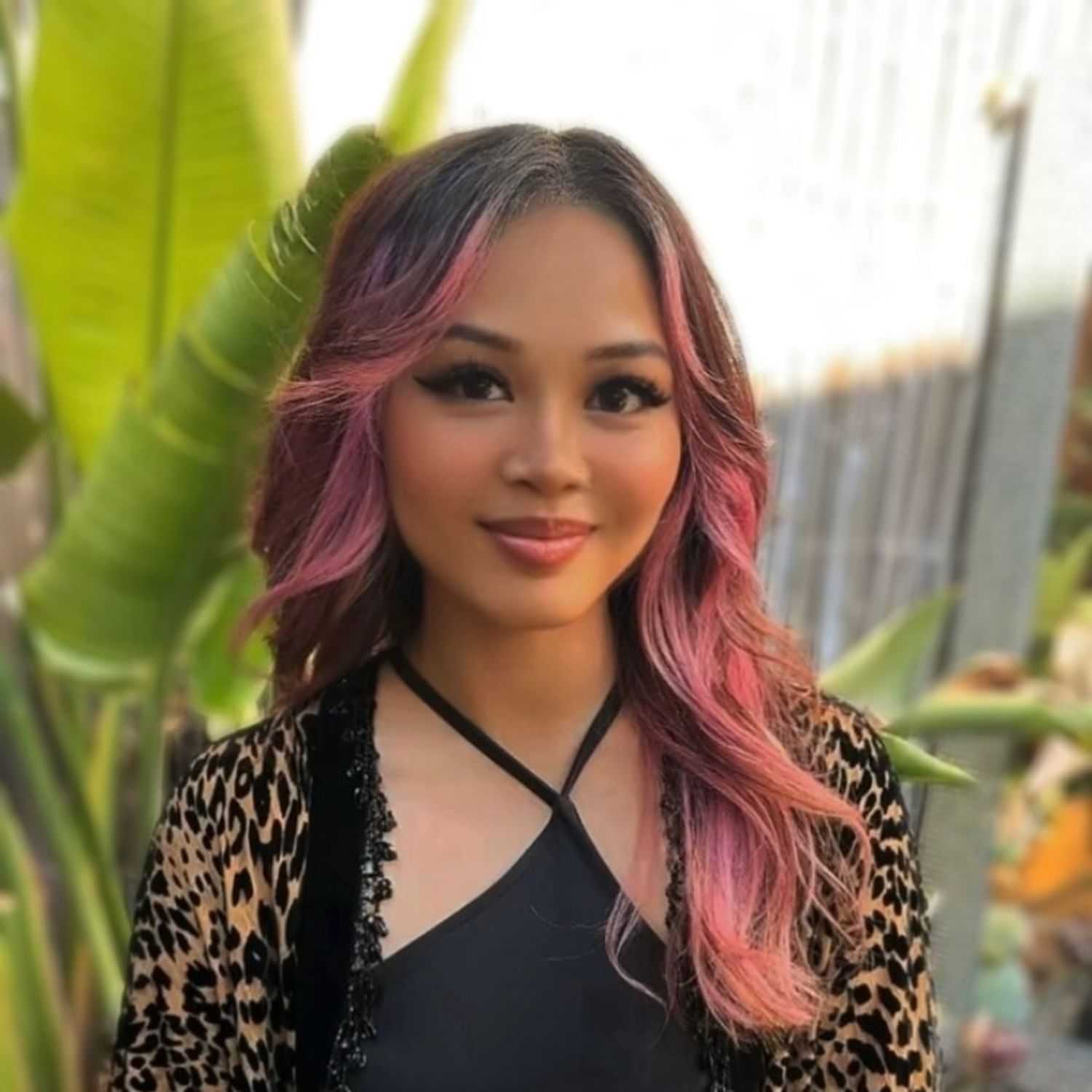 Portrait of KEILANI, a professional stylist at 77Salon Inc., showcasing their expertise and style.