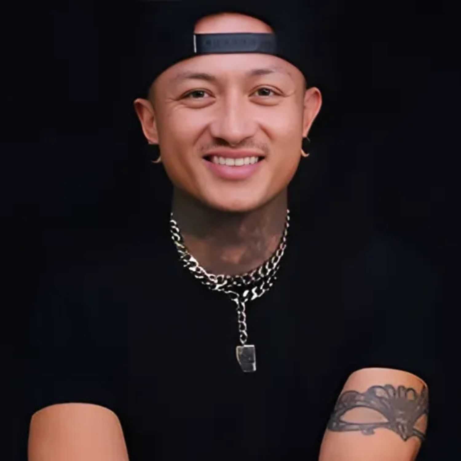 Portrait of CJ, a professional stylist at 77Salon Inc., showcasing their expertise and style.