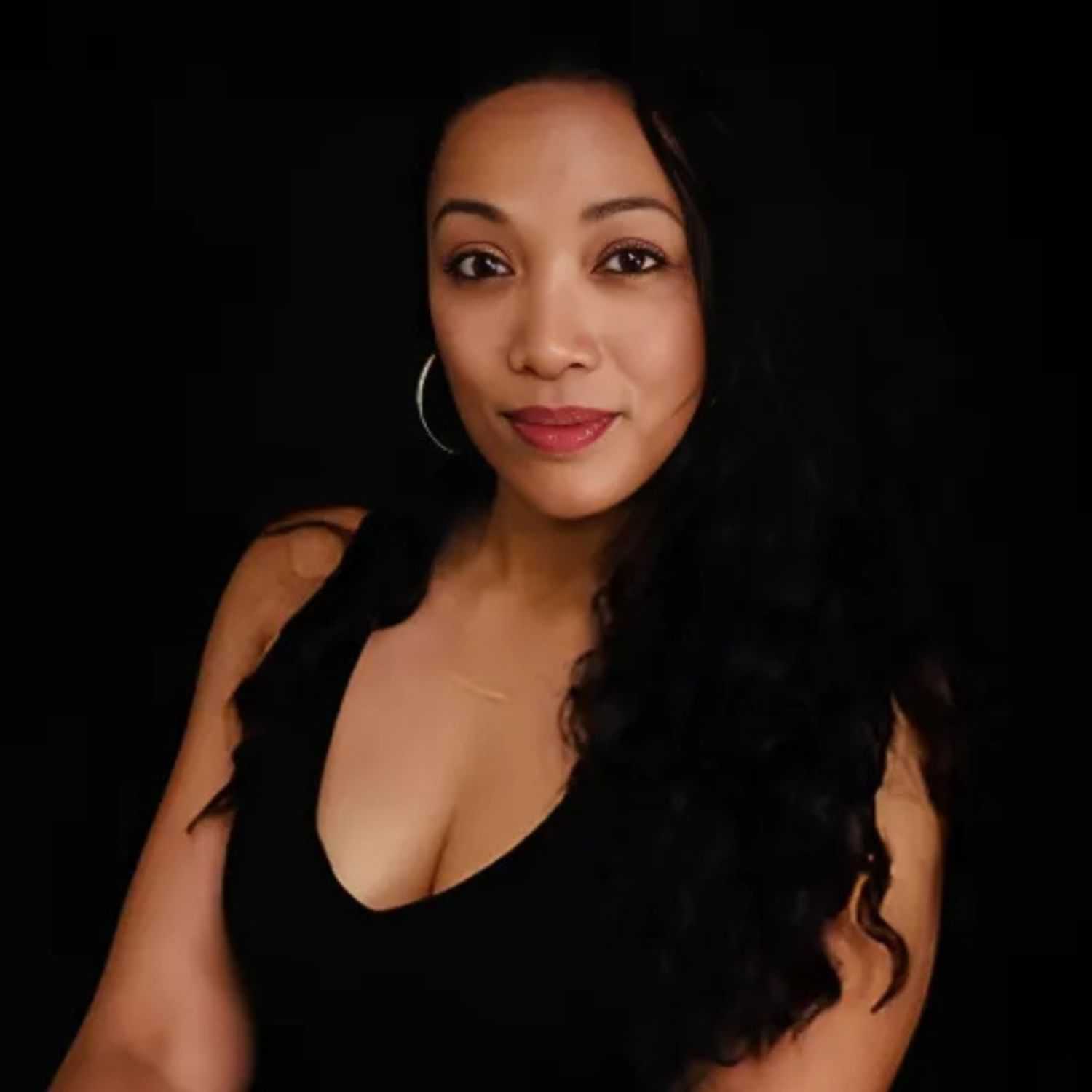 Portrait of NIKKI, a professional stylist at 77Salon Inc., showcasing their expertise and style.