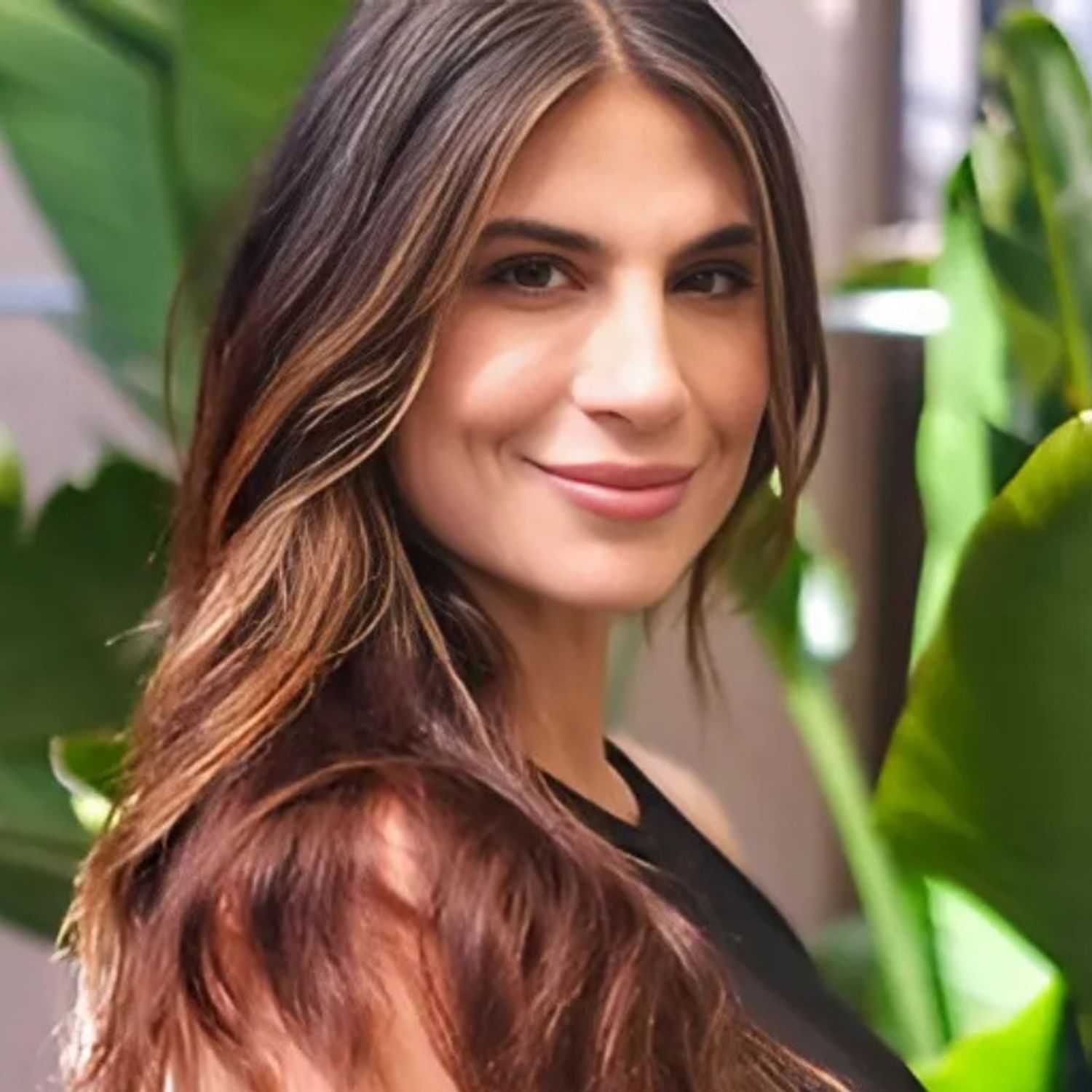 Portrait of ASHLEY, a professional stylist at 77Salon Inc., showcasing their expertise and style.